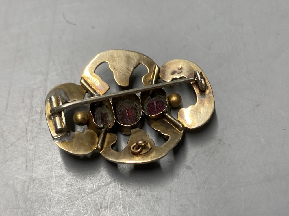 Two gold plated overlaid and gem set fob seals, largest 35mm, a 9ct front and back locket and a scroll brooch.